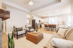 03-fourmile-creek-open-concept-living-kitchen-granite-island