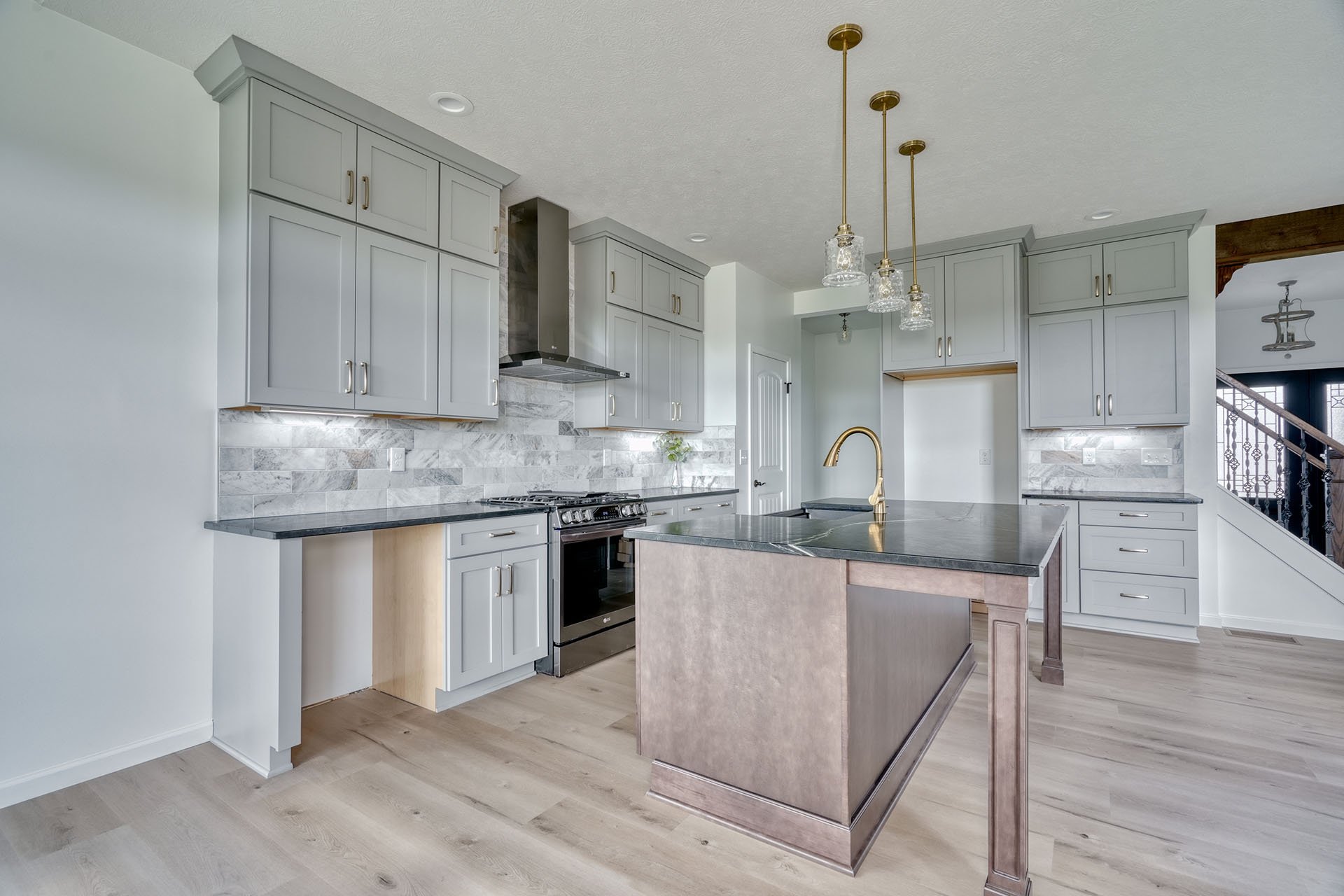 neutral kitchen L-shaped kitchen with an island in custom home by Gerber in Canandaigua