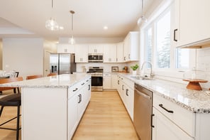 Greater Rochester kitchen with granite countertops, subway tile backsplash, black cabinet pulls, and stainless steel dishwasher