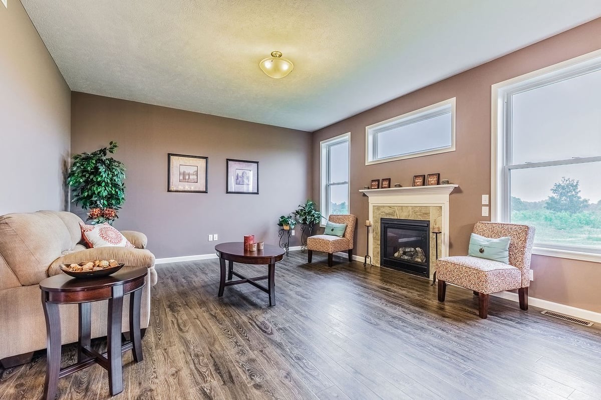 Custom Living Room, Great Room, Wooden Flooring, Custom Window Set, and Stone Fireplace