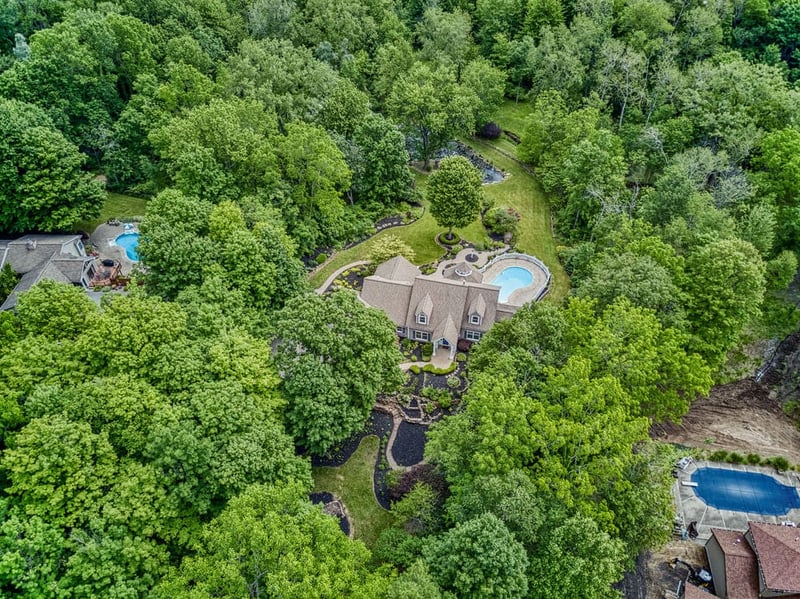 Drone view of upstate Rochester, NY luxury custom home with pool
