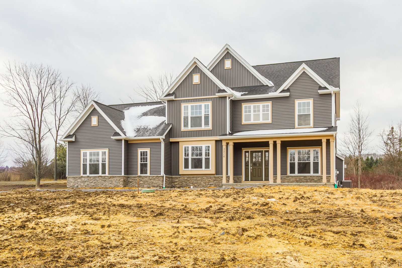 Front exterior of new construction home in Canandaigua, NY on overcast day