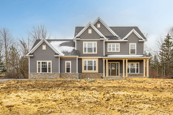 Front exterior of new construction home in Canandaigua, NY under blue sky