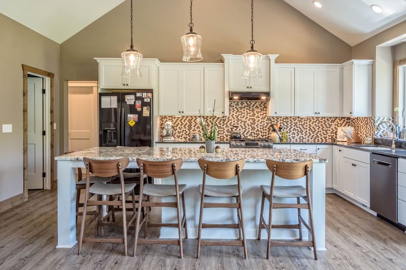 Custom built kitchen with mosaic tile backsplash in Greater Rochester by Gerber Homes