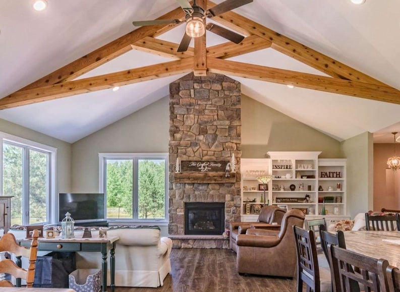 Cathedral Ceiling Wooden Beams, Stone Accents for Stone Fire places, open windows, recessed lighting, great room with dining room and kitchen by Gerber Homes 228 Ridge Road-1