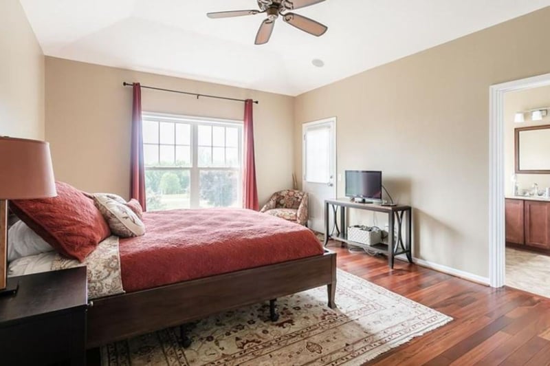 Master bedroom with double window, hard wood floors, walk-in closet, on-suite  full bathroom, ceiling fans, by Gerber Homes 4958 Hillcrest