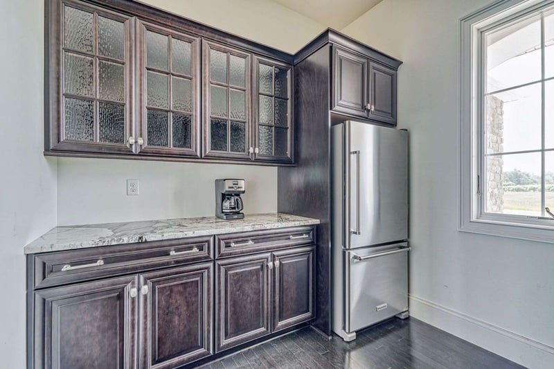 Custom Architectural Home, Beverage Station, Dark wood cabinets, glass door cabinets, marble countertops