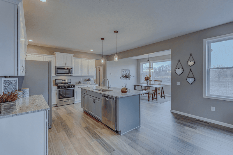 Kitchen in greater Rochester, NY custom home by Gerber Homes with sink and dishwasher in island