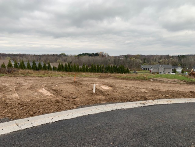 Land development progress for new home construction near Rochester, NY on cloudy day