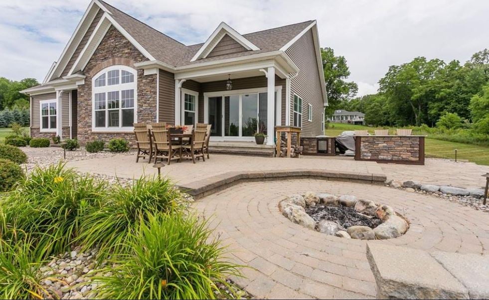 Backyard Patio of Custom Home With Custom Stone Fire Pit and Walkway