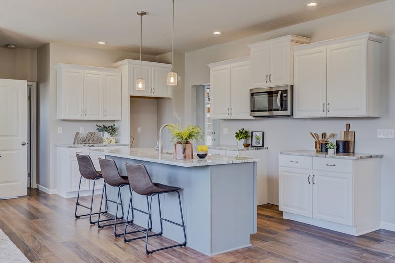 Kitchen island with seating in greater Rochester custom home by Gerber Homes