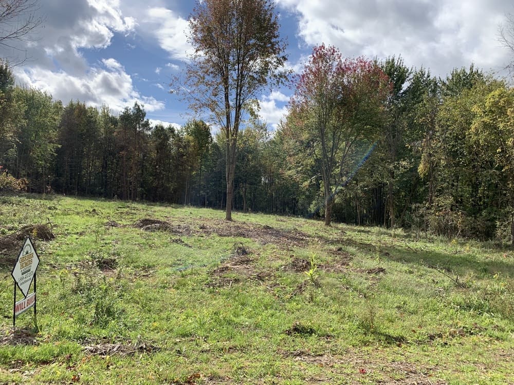 Ontario Center Road by Gerber Homes custom home community lot on sunny day 