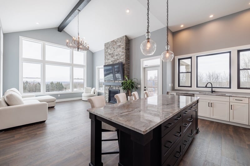Open-concept custom home interior with island in kitchen by Gerber Homes
