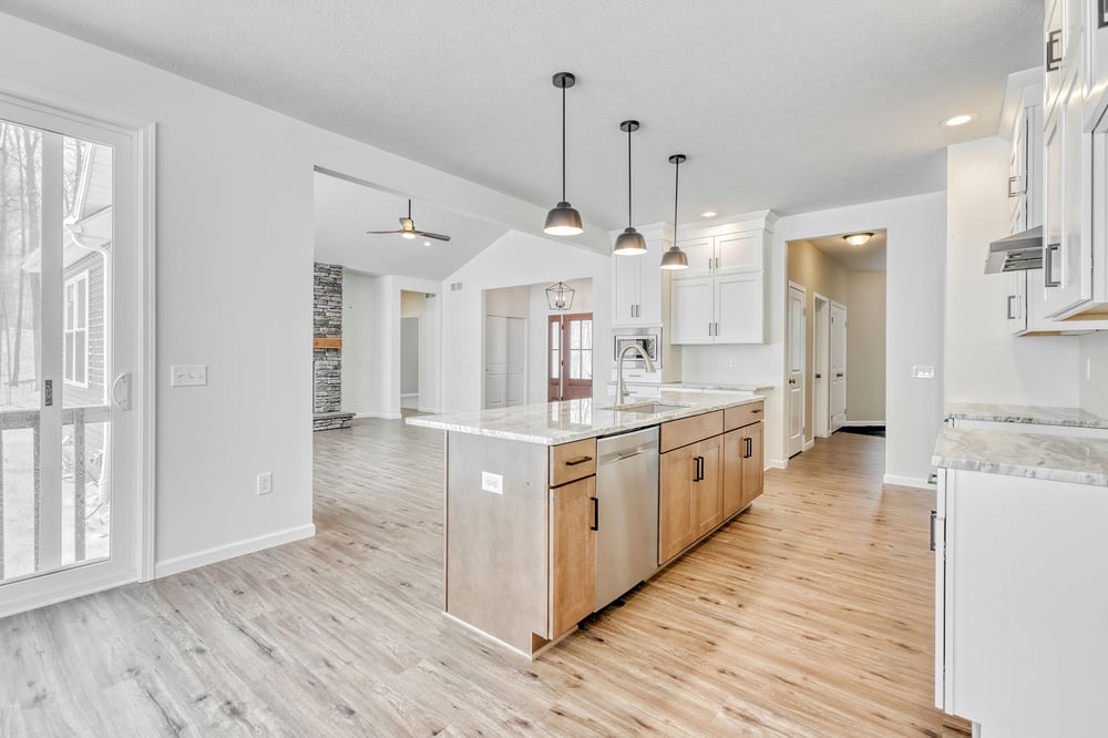 Open-concept kitchen and main floor in Rochester area custom home by Gerber Homes