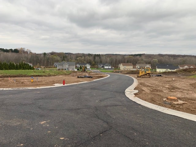 Paved road in new home community in Walworth, NY by Gerber Homes