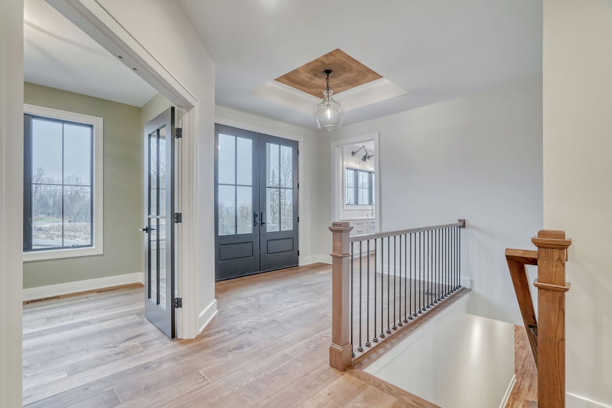 Second-story layout in Rochester-area custom home by Gerber Homes with unique lighting