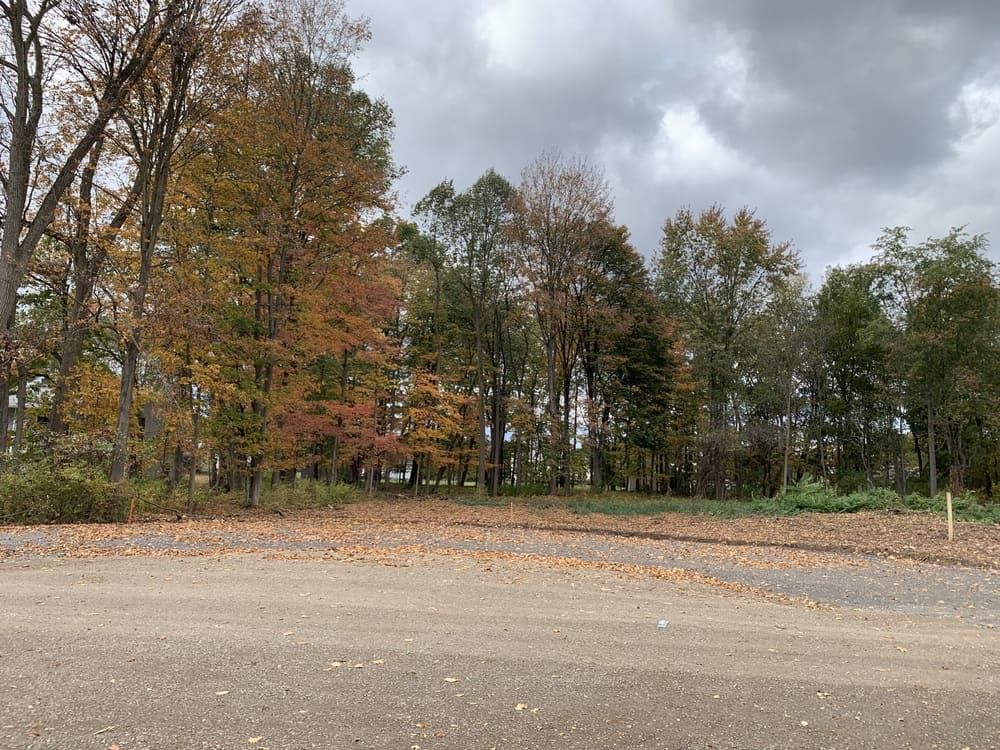 Shot of road on cloudy day in Drumlin Drive custom home community in Macedon, NY