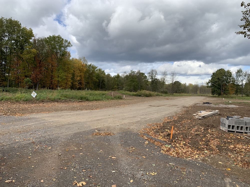 Shot of road on cloudy day in Drumlin Drive custom home community in Macedon, NY