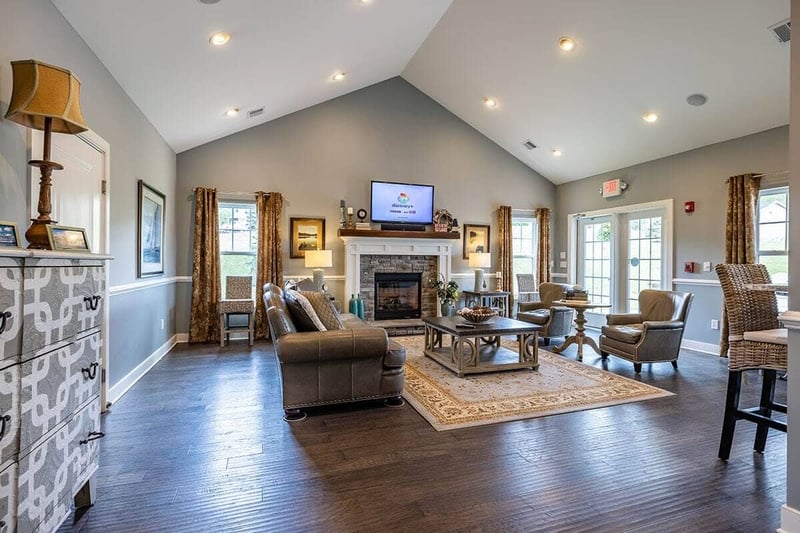 First floor in The Cottages of Canandaigua home with vaulted ceiling and fireplace