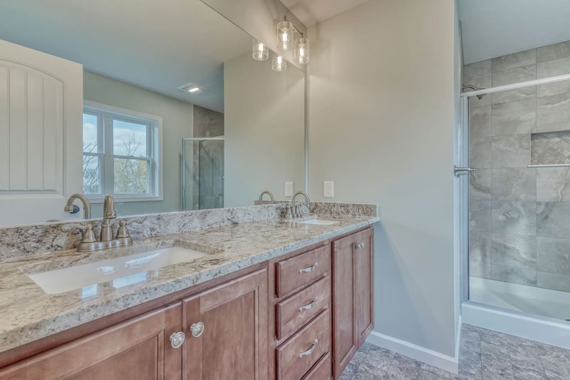Double bathroom vanity with shaker cabinets and under mount sinks
