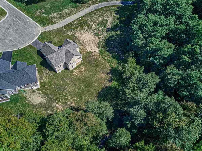 Aerial view of a new construction home and lot in Rochester