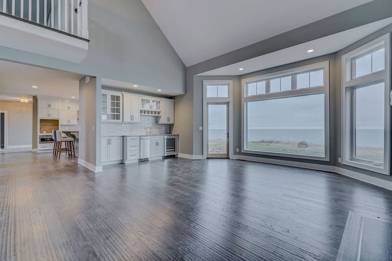 Lakefront custom home main floor open-concept interior with lakefront view by Gerber Homes