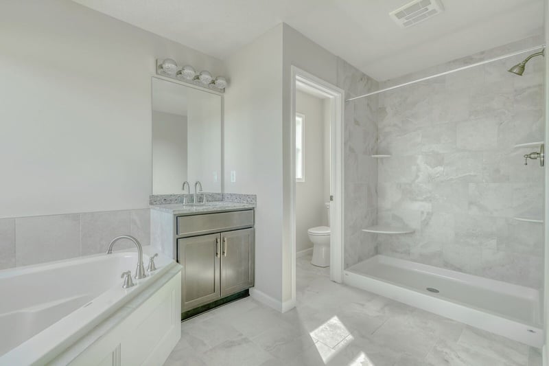 Luxury custom master bathroom with walk-in shower and under mount tub