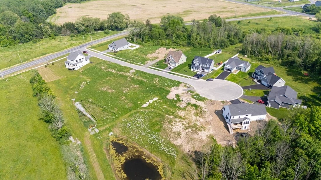 Aerial view of Southgate Hills neighborhood in the Rochester area, showing new homes and open lots