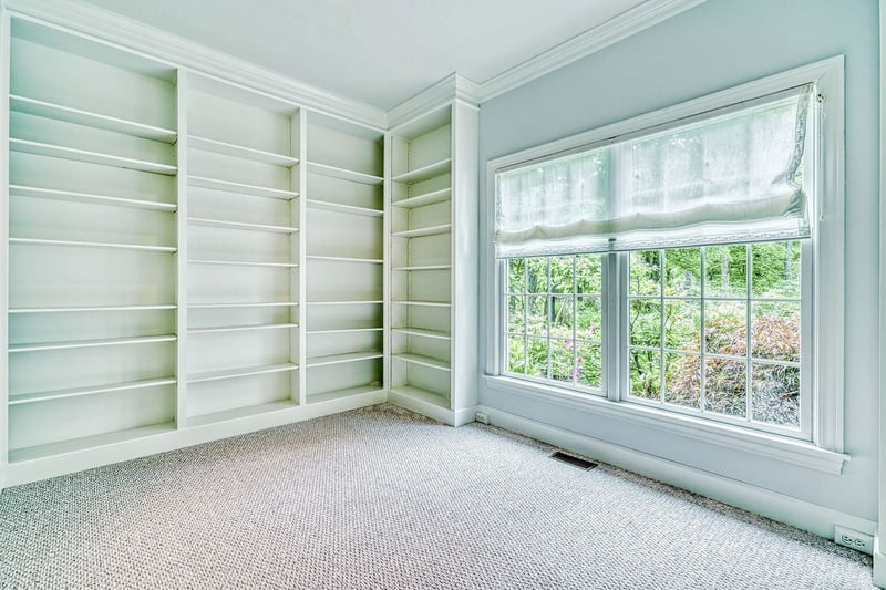 Custom built-in shelving in second story room