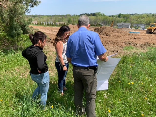 Gerber Homes team evaluating home site of Orchard View Estates