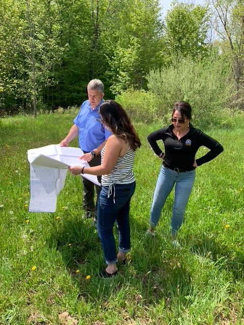 Gerber Homes team looking at new construction plans on Orchard View home site