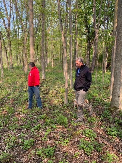 Gerber Homes team walking through land for custom home on Drumlin Drive