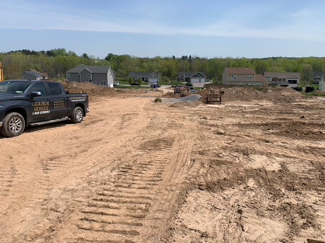 Gerber Homes truck on land site for custom home build