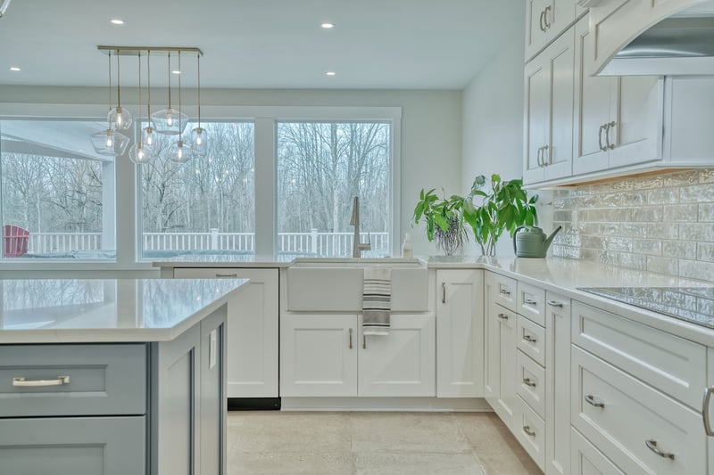 White kitchen with farmhouse-style sink in Rochester custom home by Gerber Homes
