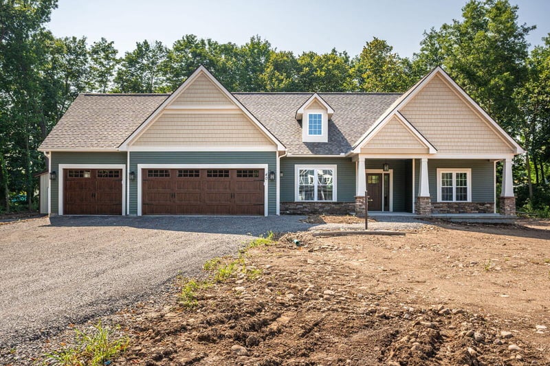 Ranch home exterior with attached 2-car garage near Rochester, NY by Gerber Homes