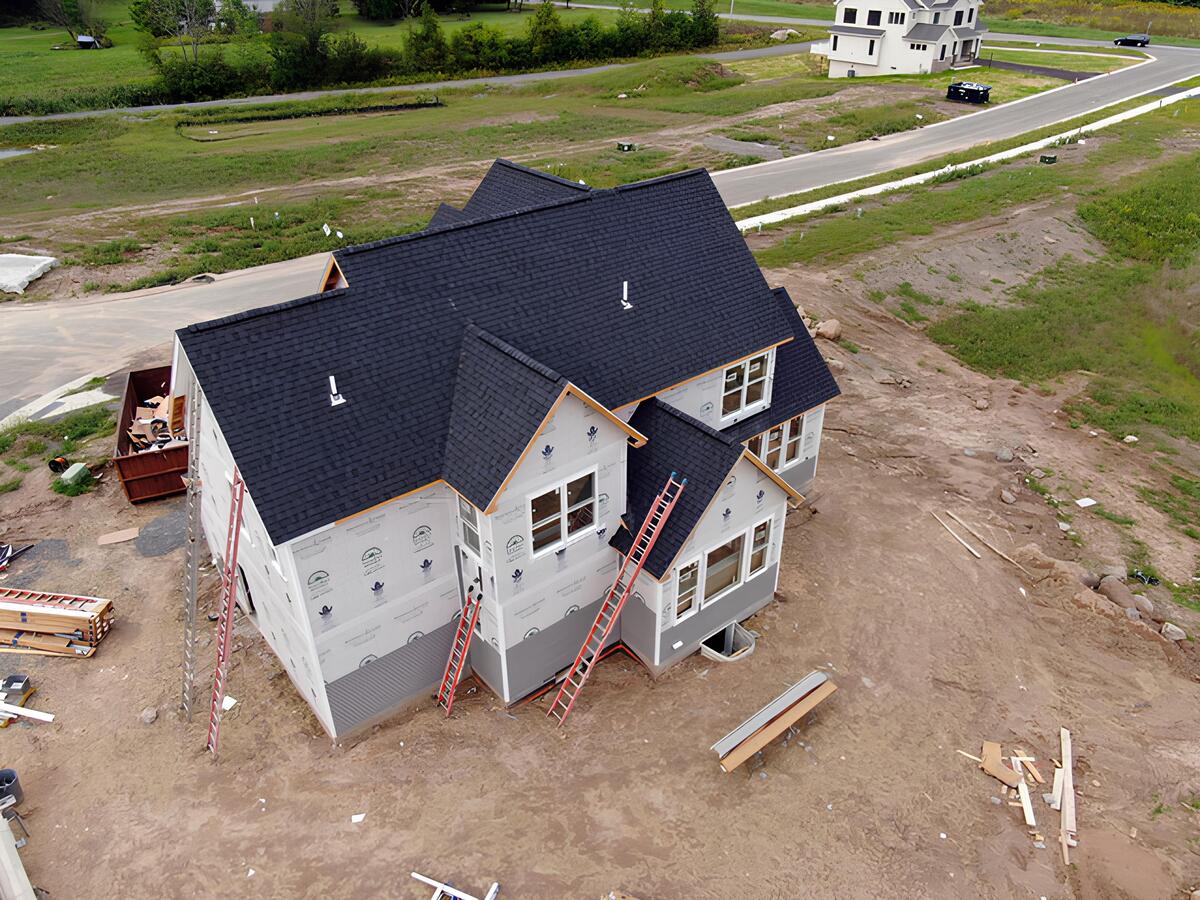Drone view of custom home construction progress in Southgate Hills new home community